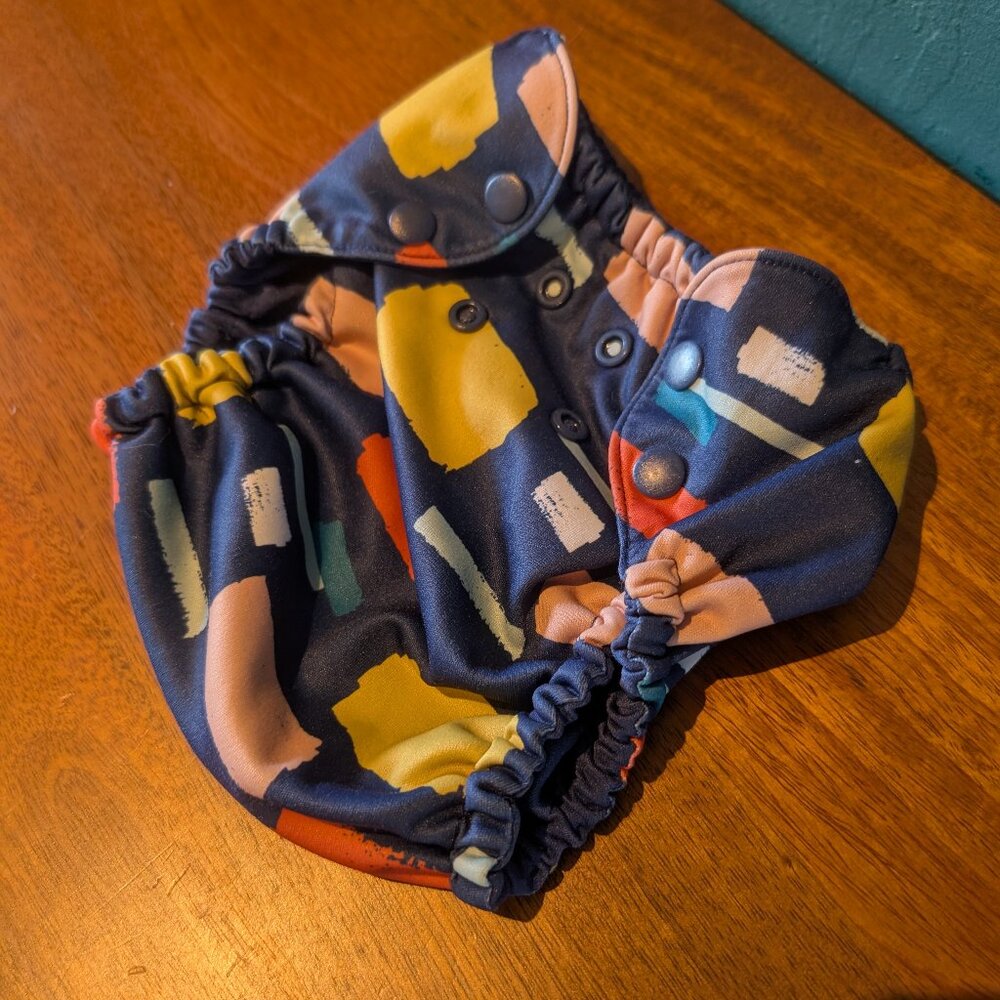 Esembly Outer Diaper Cover (Size 2) - Dark Blue with Yellow/Orange/Pink Blotches